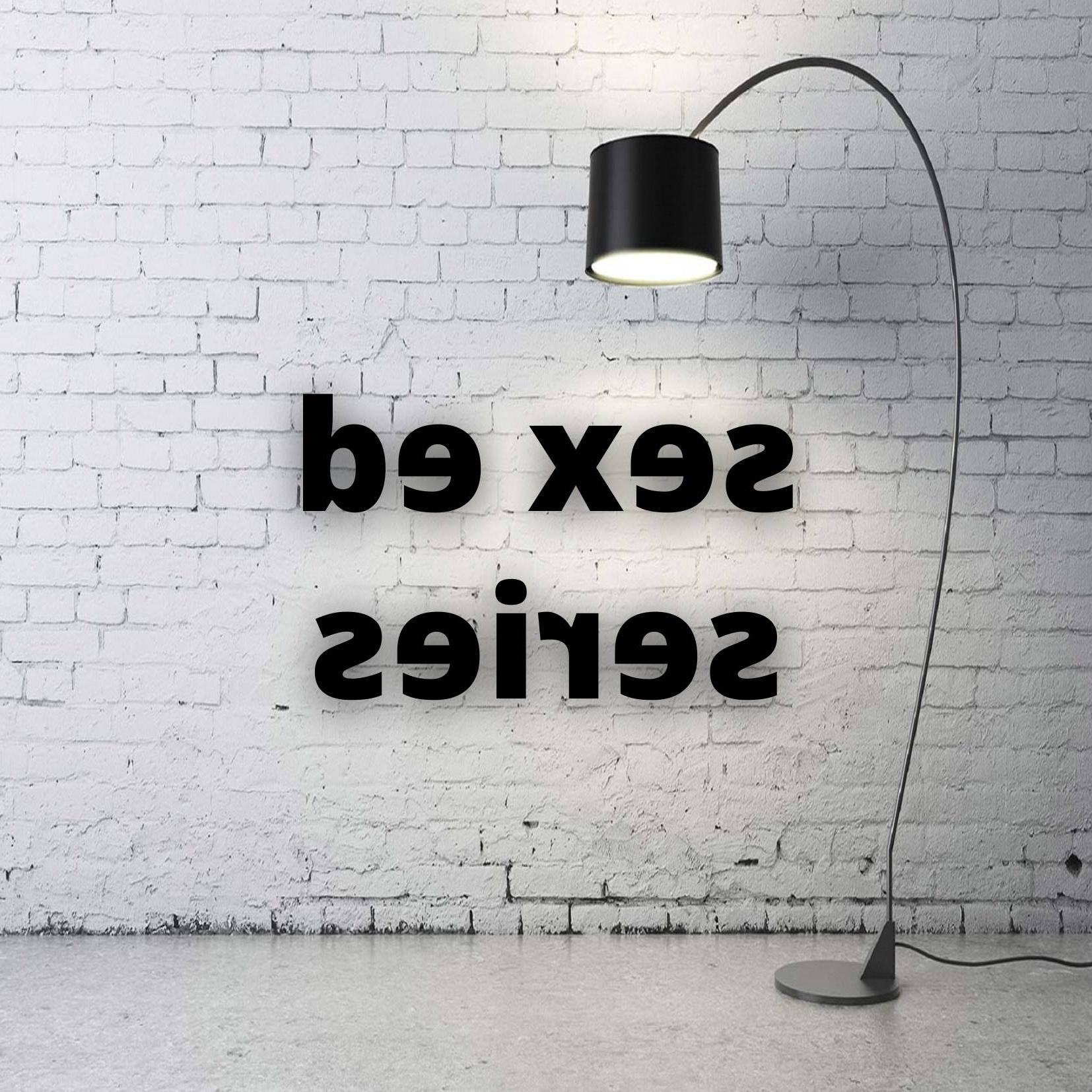 White brick wall with a lamp highlighting font that says Sex Ed Series